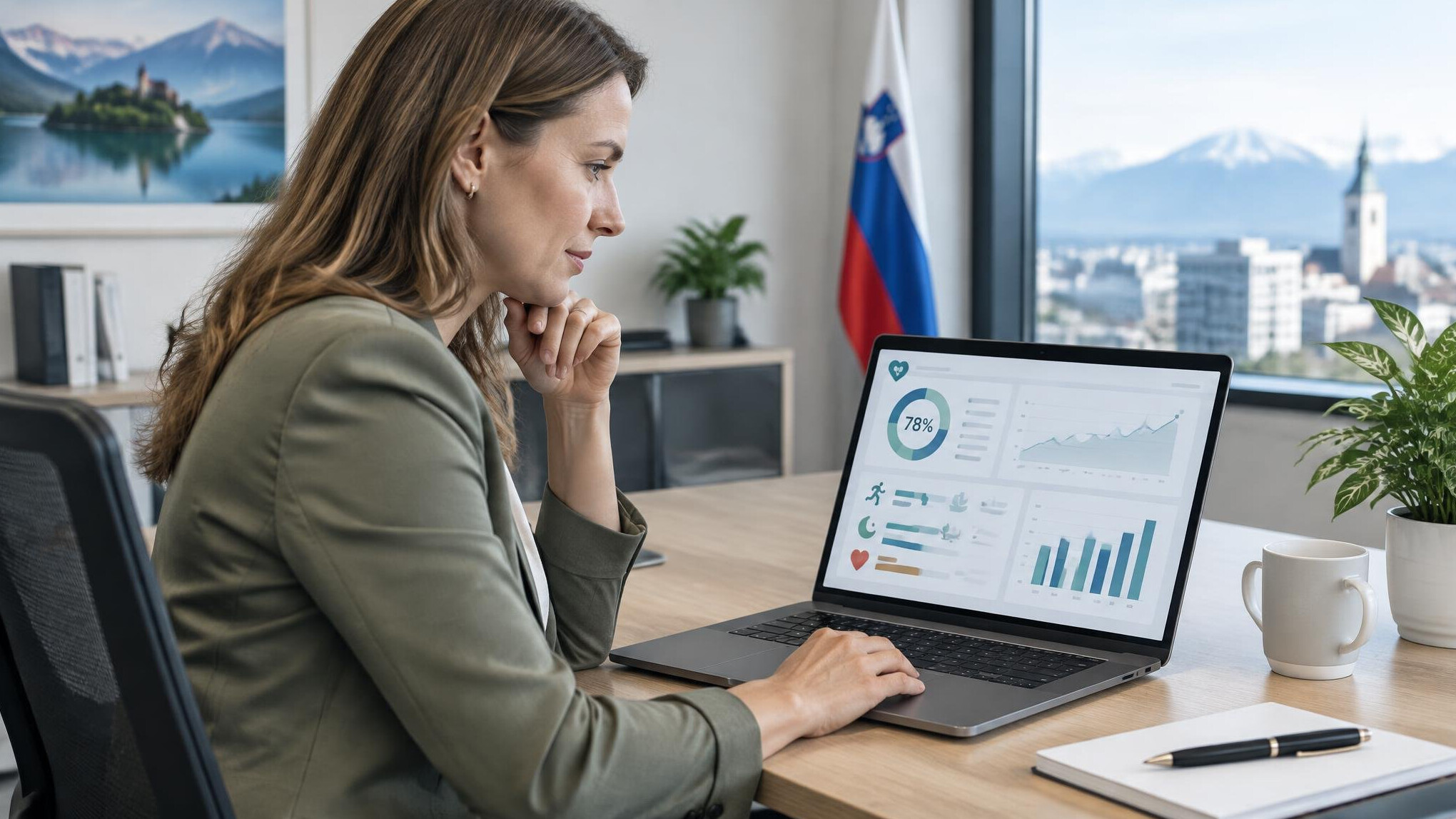 Business professional reviewing a health and wellness dashboard on a laptop